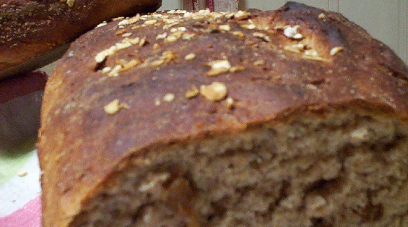 Festive artisan nut and dried fruit bread loaf studded with toasted walnuts and cranberries