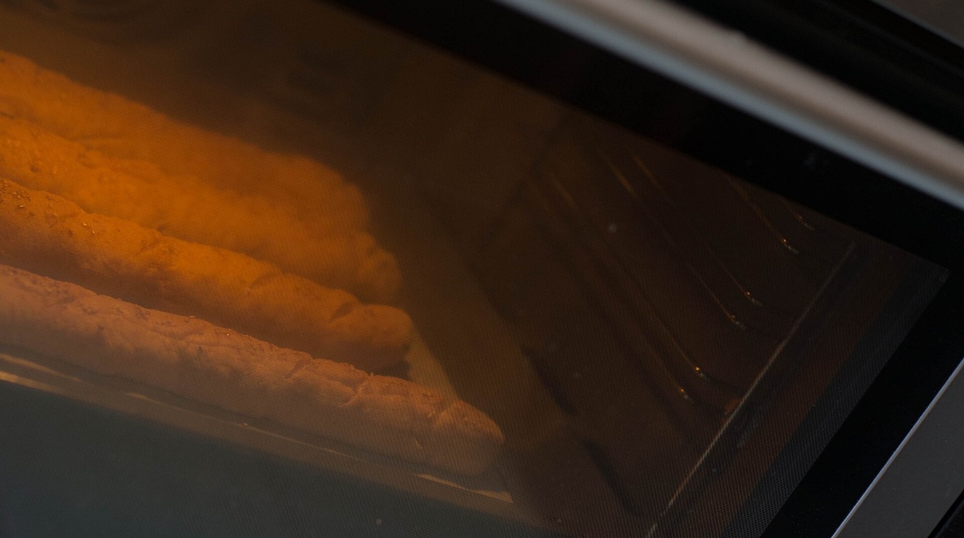 Traditional French baguettes with crisp golden crust and diagonal lame slashes